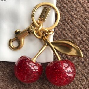 Coach Gold-Tone Cherry Key Charm with Red Glitter Cherries